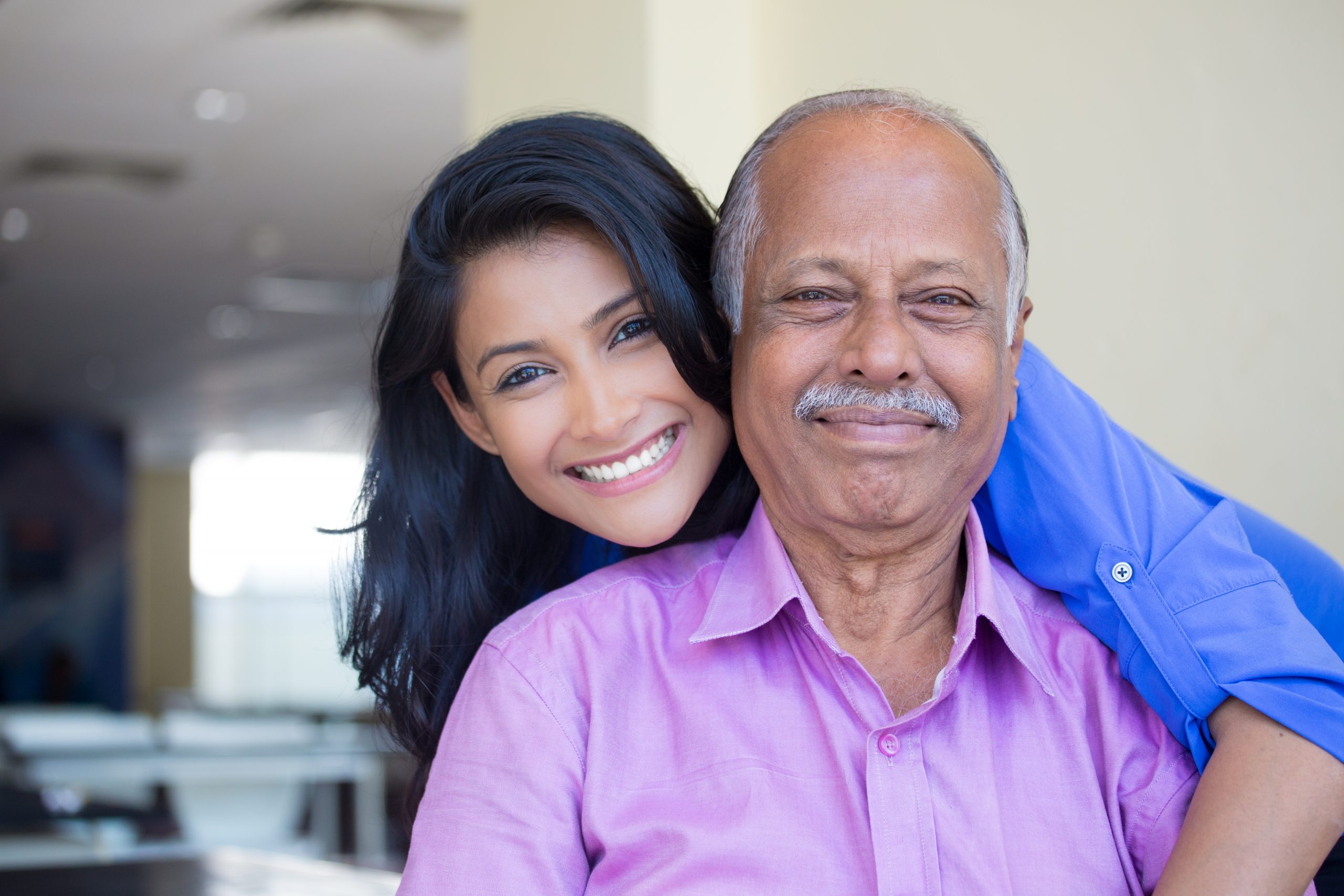 smiling woman with her senior father